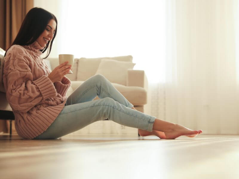 Homeowner relaxing at home with a cup of coffee