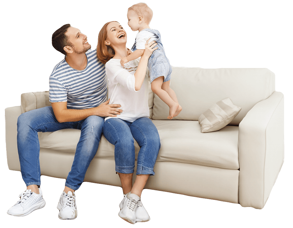 Happy family laughing together on the couch